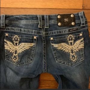 Miss me jeans with cross/wing embellishments